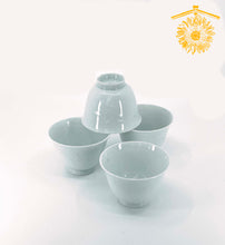 Load image into Gallery viewer, Pale blue porcelain ochoko cups with a delicate embossed flower design.
